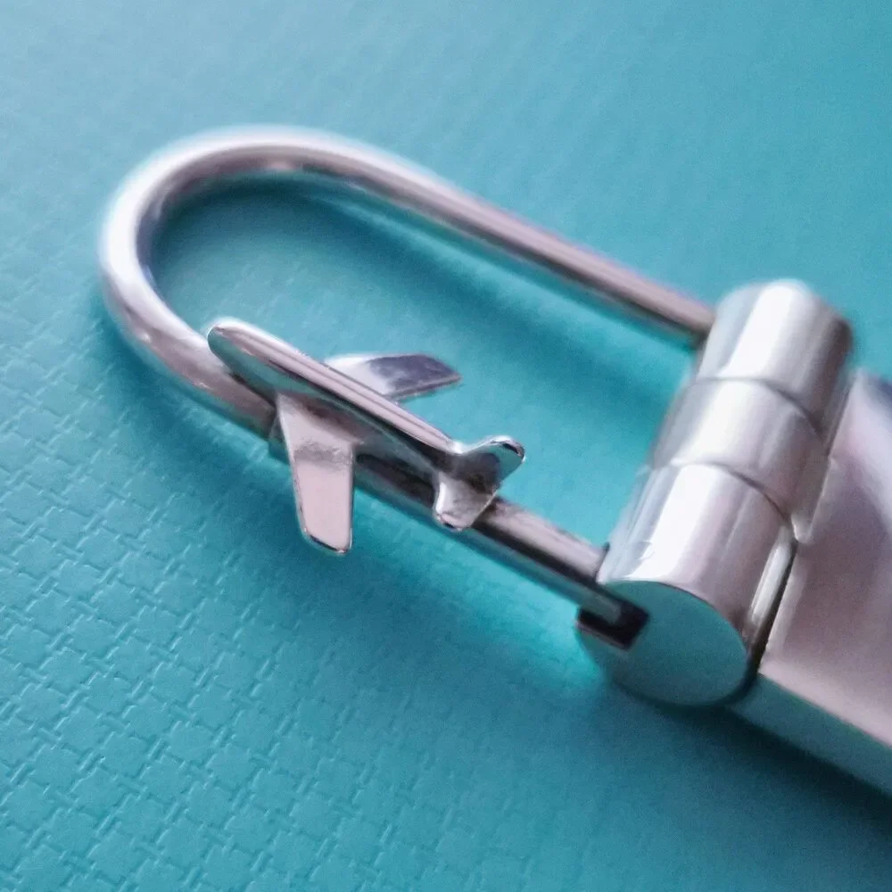 RARE Tiffany & Co. Sterling Silver Globe & Airplane Travel Lock Key Ring